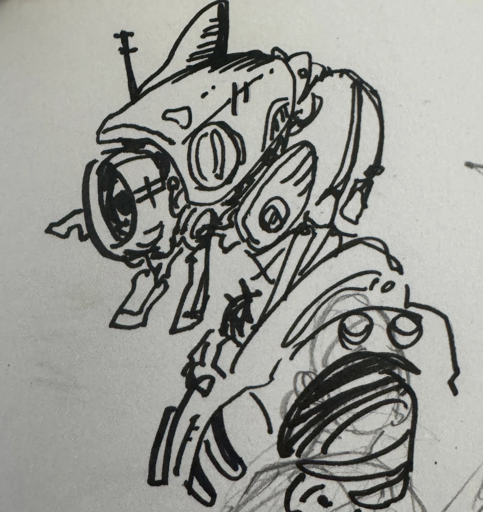A close ink drawing of an armoured creature's head, worked in heavy black marker over a faint pencil rough.