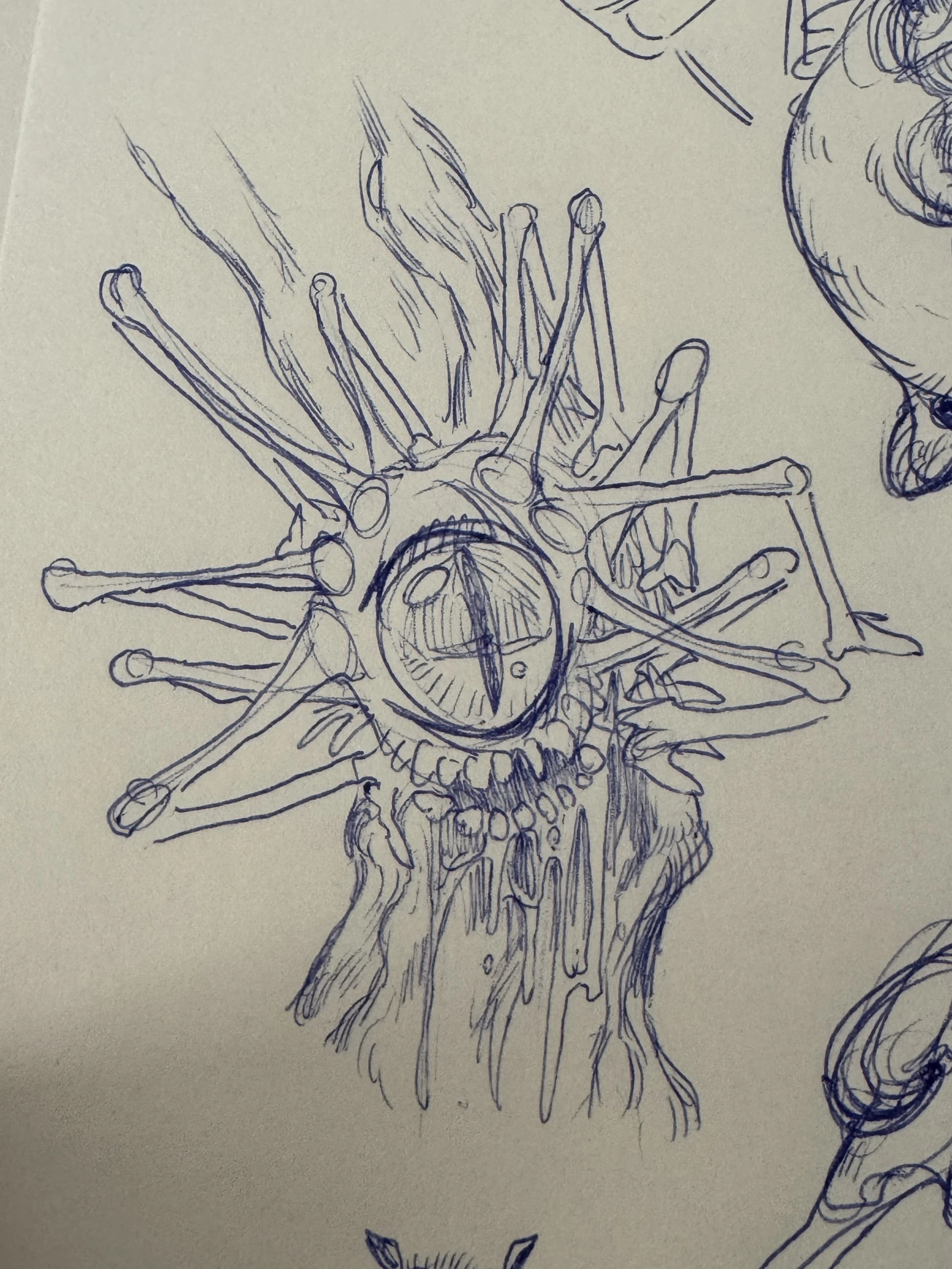 A ballpoint drawing of a many-limbed creature with one large eye, its bone-like arms fanning out from a tree stump body.
